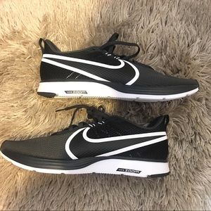 nike running air zoom strike trainers in black